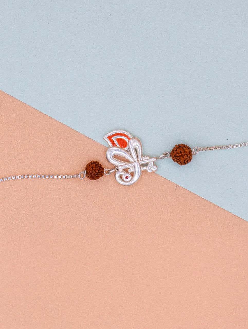 Silver Peacock Rakhi with Rudraksha Beads