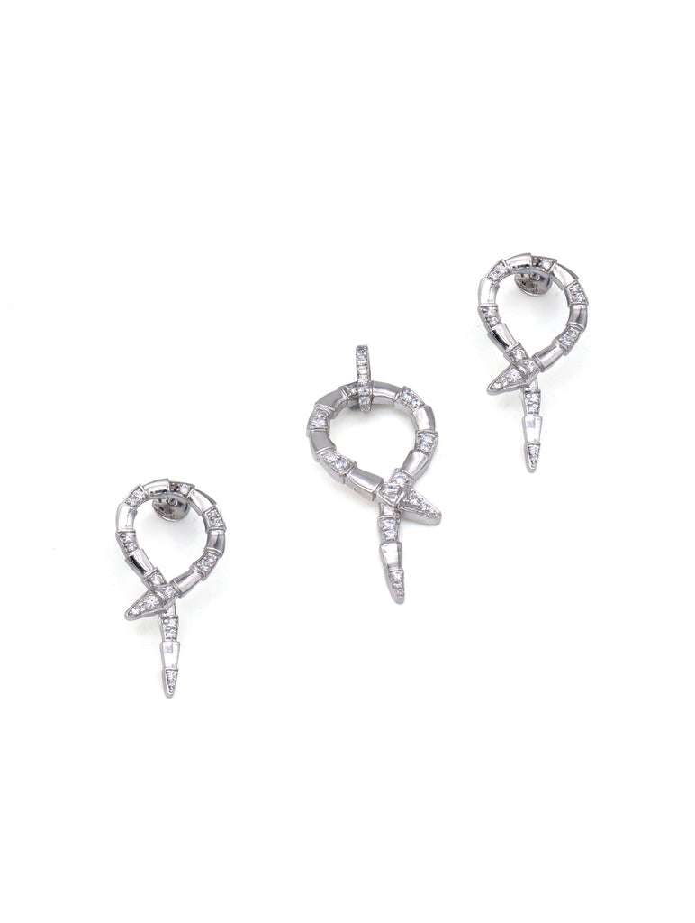Pair of silver earrings with bow design on a white background