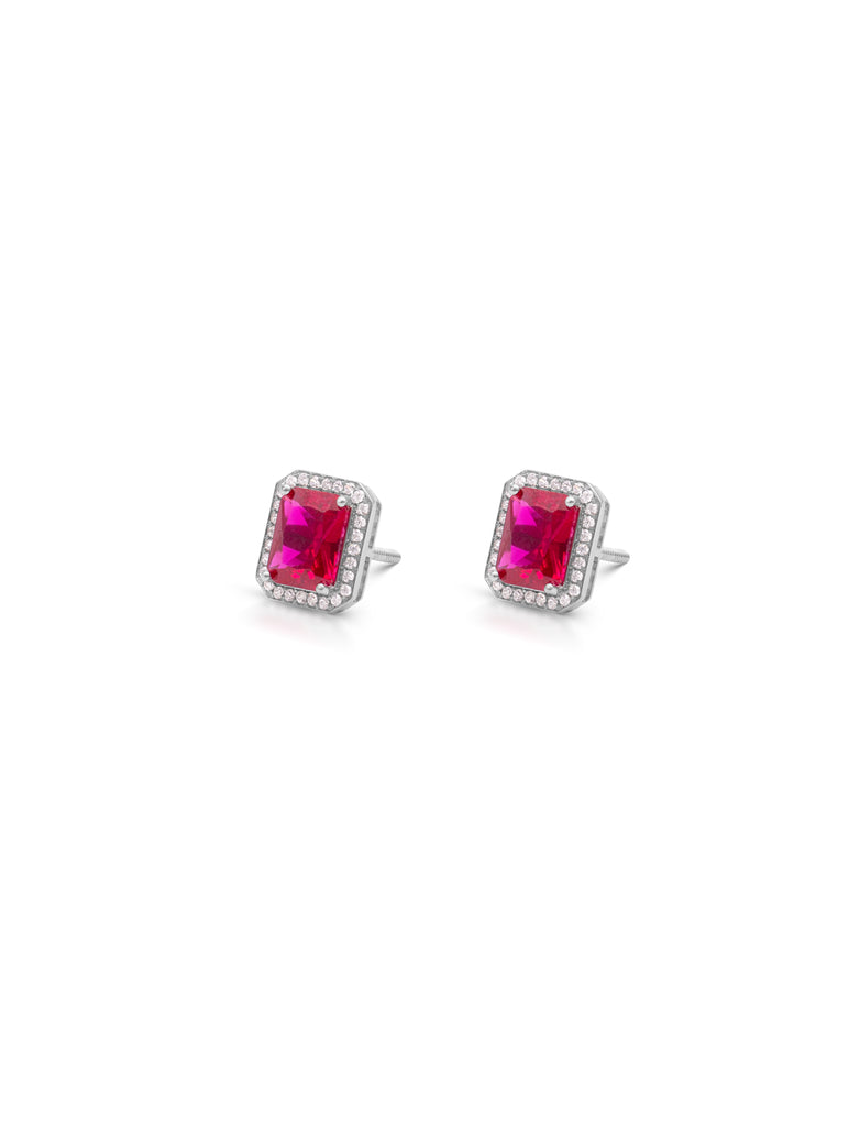 Pair of earrings with red gemstones on a white background